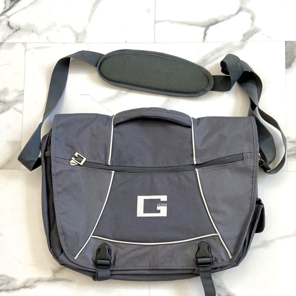 New GUESS laptop luggage. Padded on both sides of bag for laptop protection.